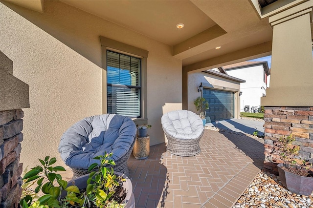 view of patio featuring a garage