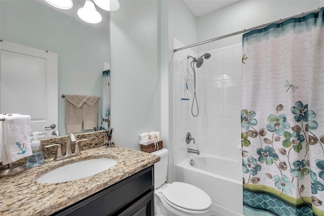 full bathroom with vanity, shower / bath combination with curtain, and toilet