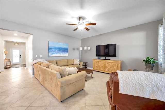 tiled living room with ceiling fan