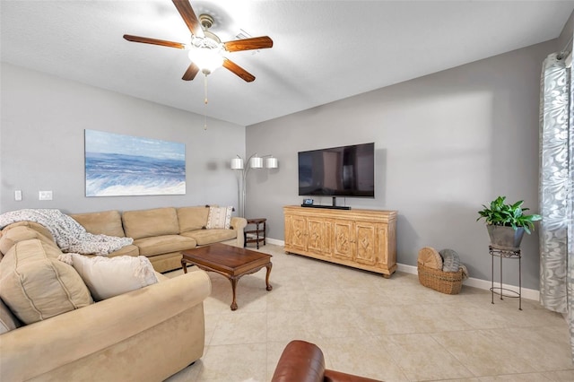 living room with ceiling fan and light tile patterned floors