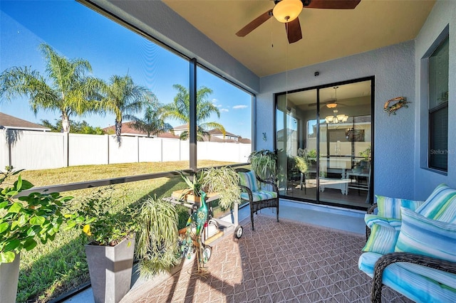 sunroom with ceiling fan