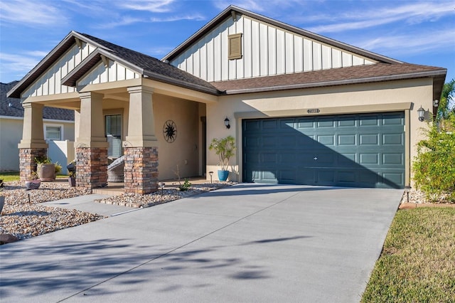 view of front of property with a porch and a garage