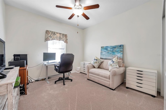 carpeted office space with ceiling fan