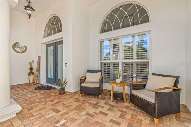 interior space featuring french doors and a high ceiling