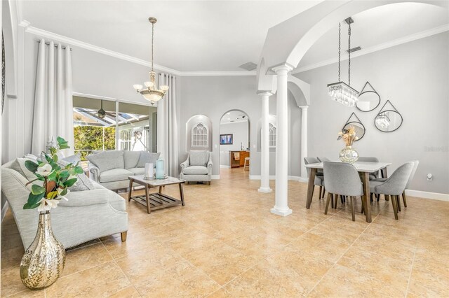 dining area featuring ceiling fan with notable chandelier, ornate columns, and crown molding