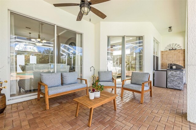 view of patio with glass enclosure and ceiling fan