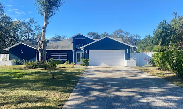 single story home with a front lawn and a garage