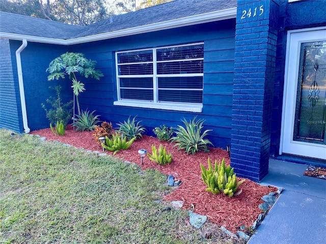 view of home's exterior featuring a shingled roof