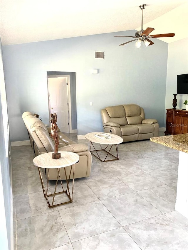 living room featuring lofted ceiling, baseboards, visible vents, and a ceiling fan