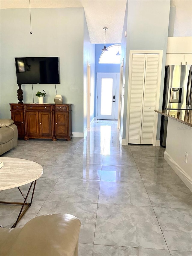 living room featuring baseboards