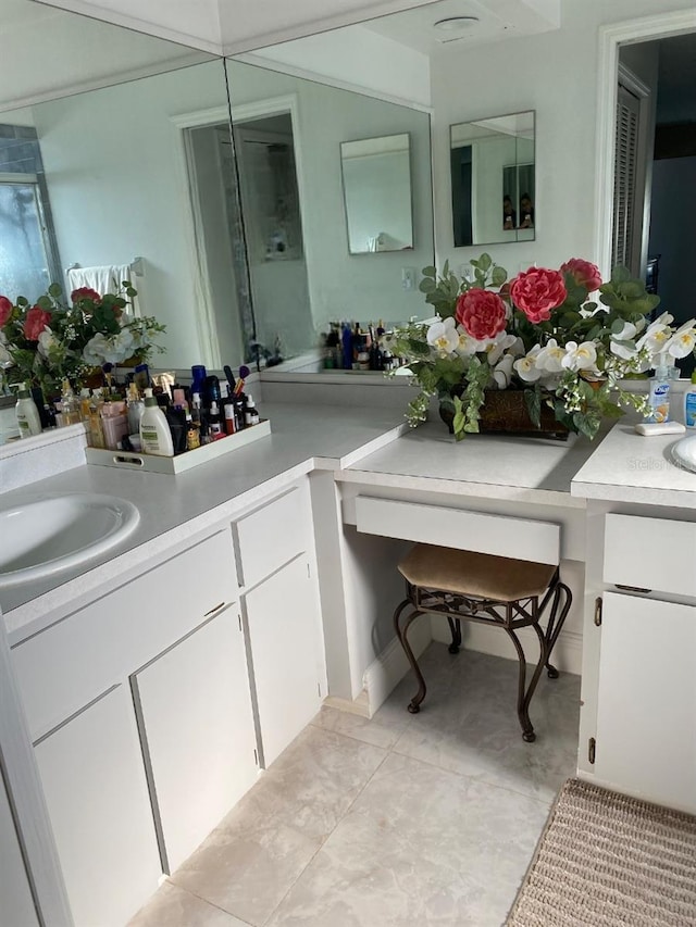 bathroom with tile patterned flooring and sink