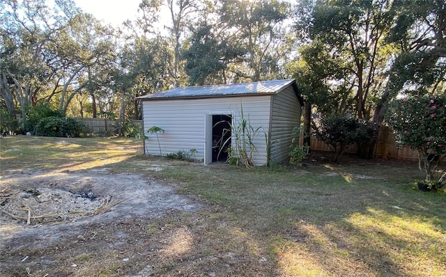 view of outbuilding featuring a lawn