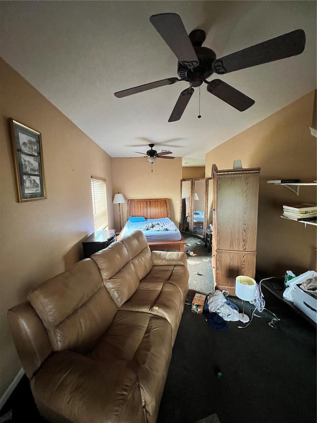 living room featuring ceiling fan and lofted ceiling