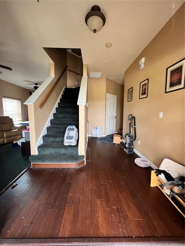 interior space featuring hardwood / wood-style flooring, ceiling fan, and lofted ceiling