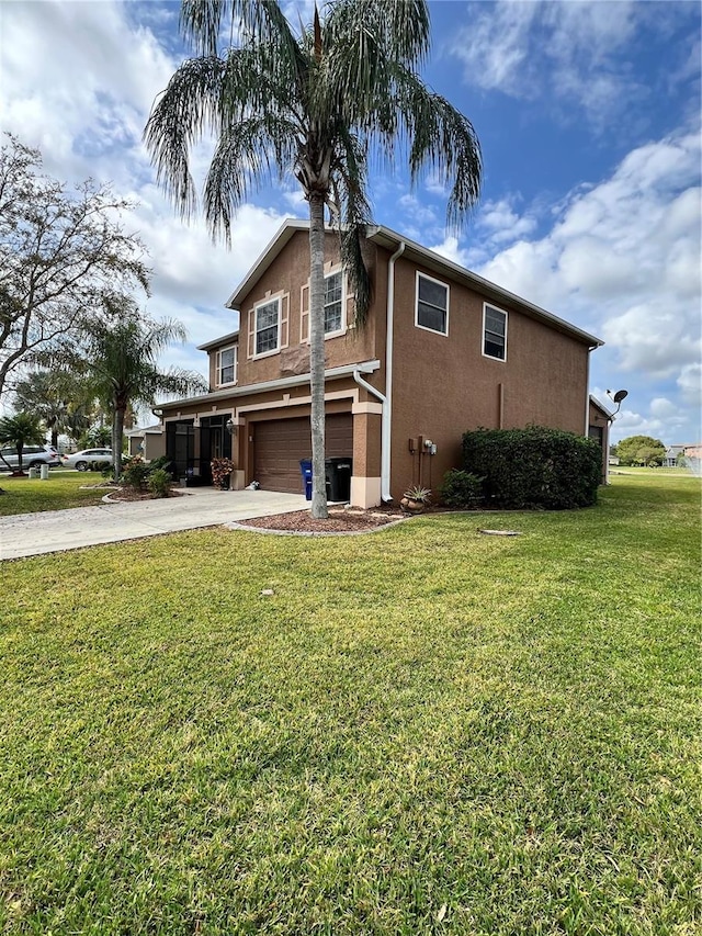 view of side of home with a lawn and a garage