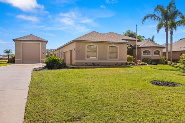 mediterranean / spanish-style house with a garage and a front yard