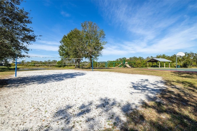 view of property's community featuring a gazebo, basketball hoop, and volleyball court