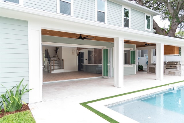 back of house with ceiling fan, area for grilling, and a patio area