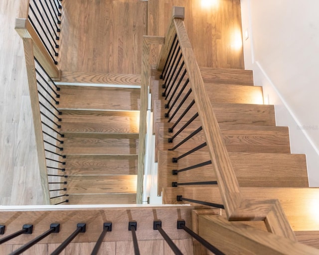 stairway featuring hardwood / wood-style floors