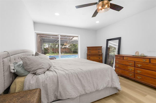 bedroom with access to outside, light hardwood / wood-style floors, and ceiling fan