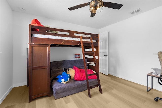 bedroom featuring light hardwood / wood-style flooring and ceiling fan