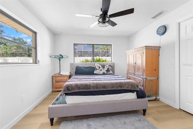 bedroom featuring light hardwood / wood-style flooring and ceiling fan