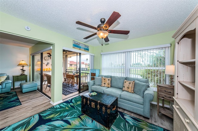 sunroom / solarium with ceiling fan and a healthy amount of sunlight