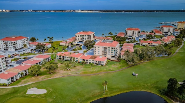 birds eye view of property with a water view