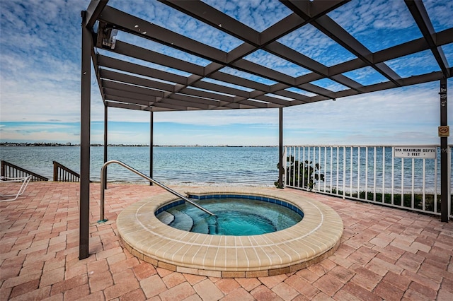 view of swimming pool with a pergola, a water view, and a hot tub