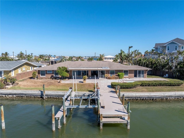 view of dock featuring a water view and a patio