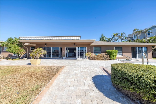 view of front facade featuring a patio and ceiling fan