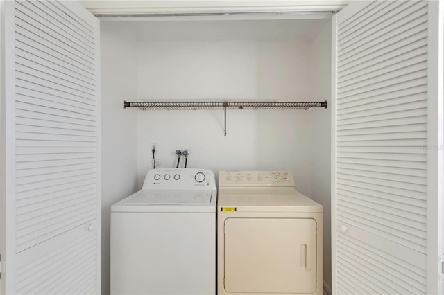 laundry area with separate washer and dryer