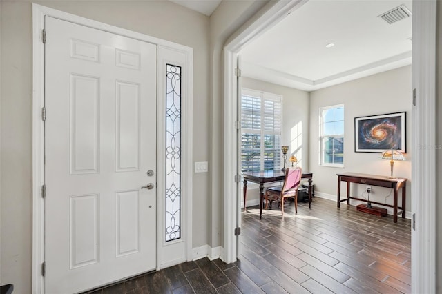 entryway with dark hardwood / wood-style flooring