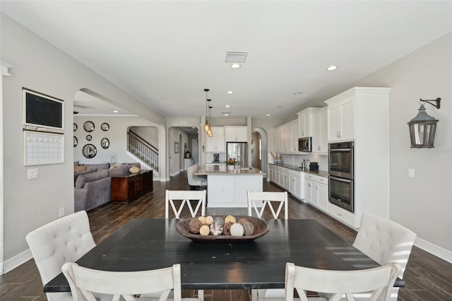 dining space featuring dark hardwood / wood-style floors