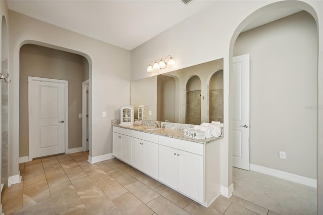 bathroom with tile patterned flooring and vanity