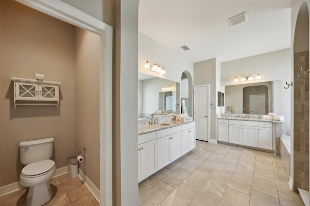 bathroom with tile patterned floors, vanity, and toilet