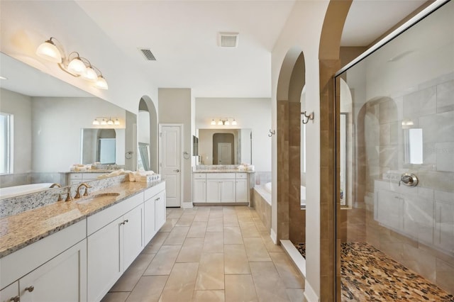 bathroom featuring vanity, separate shower and tub, and tile patterned floors