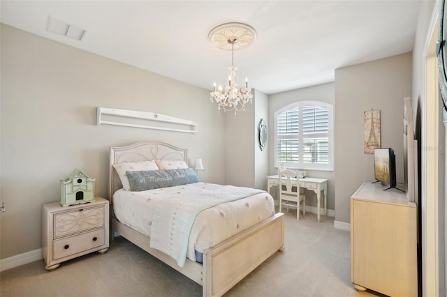 bedroom featuring light carpet and a chandelier