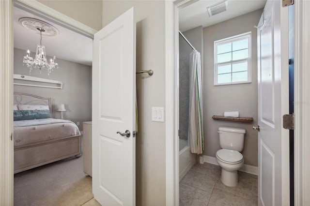 bathroom with a chandelier, shower / bath combination with curtain, tile patterned floors, and toilet