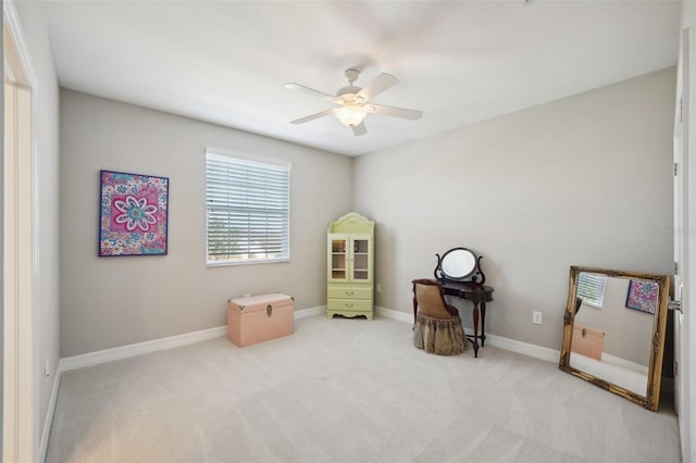 misc room with ceiling fan and light carpet