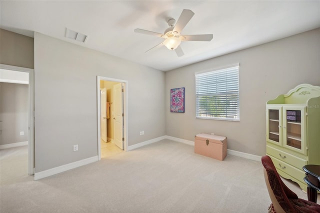 interior space with connected bathroom and ceiling fan