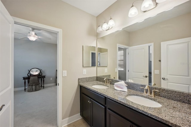 bathroom with ceiling fan and vanity