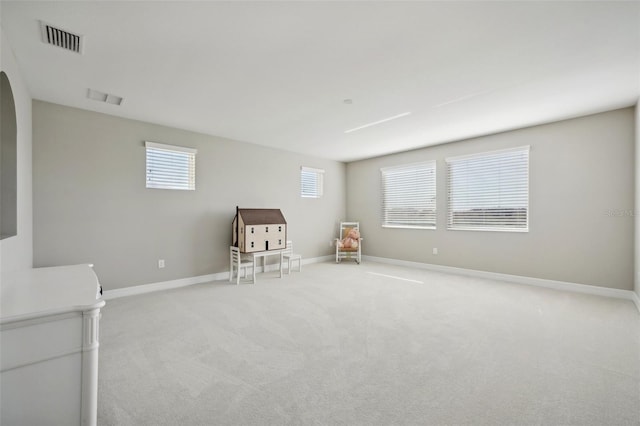 interior space featuring light carpet