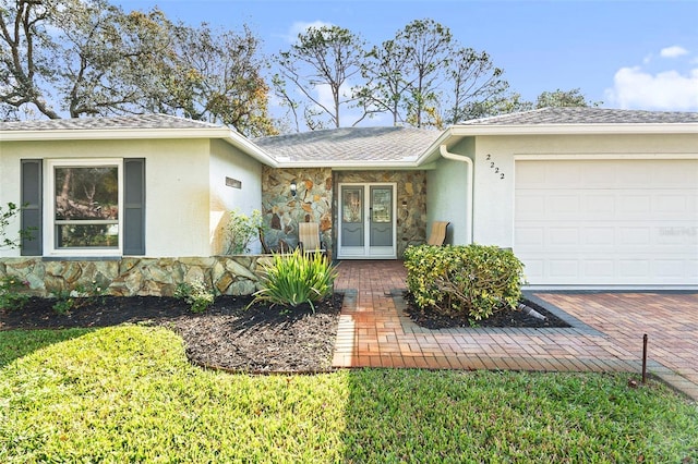 view of exterior entry featuring a garage