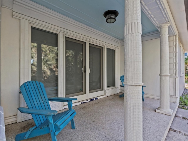 view of patio featuring covered porch and french doors