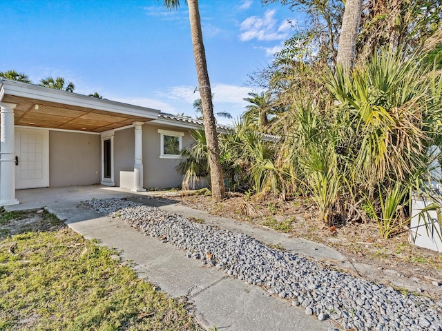 exterior space with a carport