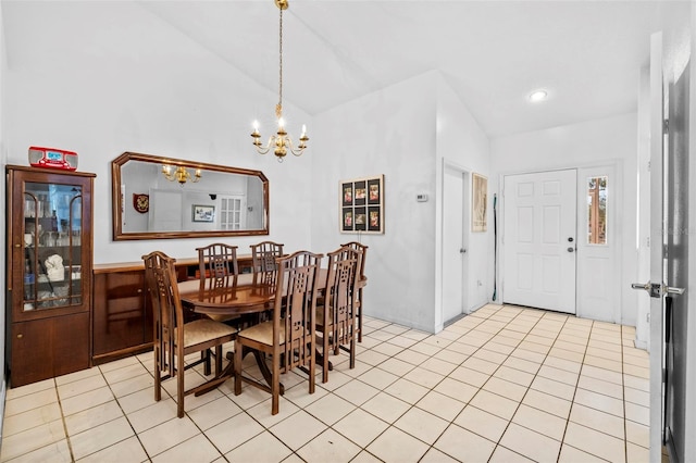 tiled dining room with high vaulted ceiling and a notable chandelier