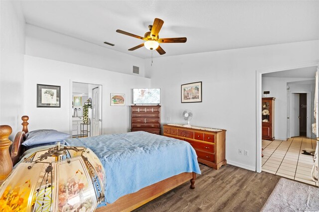 1202 Sawdust Ct, Valrico, FL 33596 - bedroom with wood finished floors, lofted ceiling, and a ceiling fan