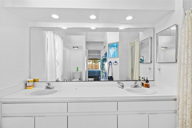 1202 Sawdust Ct, Valrico, FL 33596 - bathroom featuring double vanity, recessed lighting, and ensuite bath