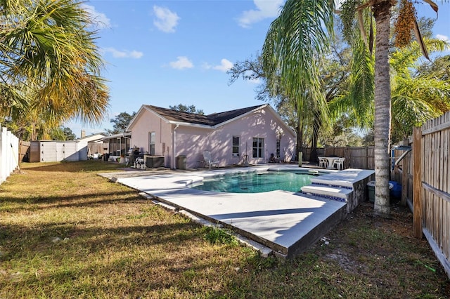 view of pool featuring a yard and a patio area